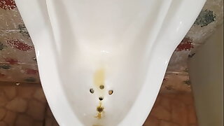 Pissing at one's disposal public urinal, showing power of my kegel muscles ;)